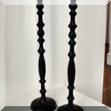 D08. Pair of tall black candlesticks. 24”h 